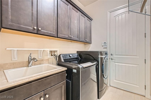 8732 Kendall Brook Cir, Las Vegas, NV 89149 - laundry area with cabinet space and independent washer and dryer