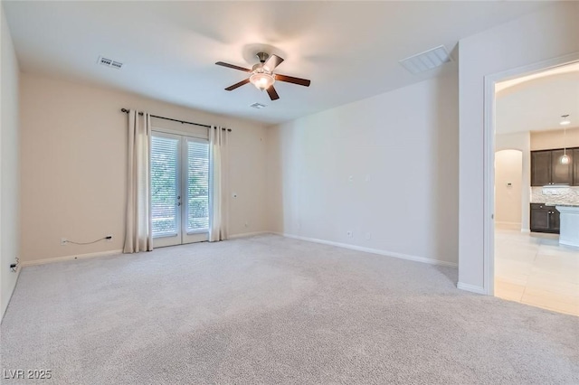 8732 Kendall Brook Cir, Las Vegas, NV 89149 - unfurnished room with ceiling fan, light carpet, and arched walkways