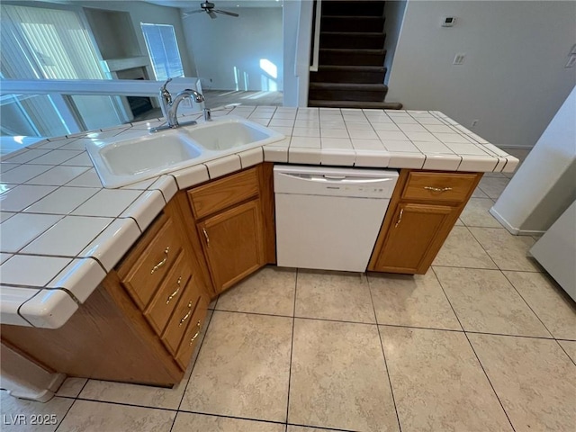 8704 Autumn Wreath Ave, Las Vegas, NV 89129 - kitchen featuring dishwasher, tile counters, brown cabinetry, and light tile patterned floors