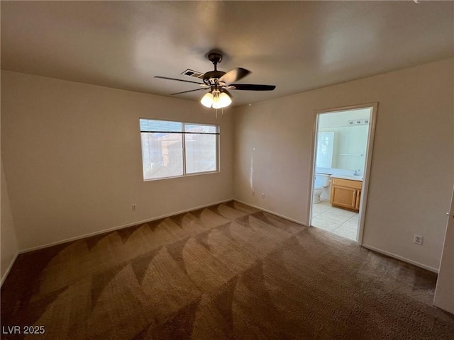 8704 Autumn Wreath Ave, Las Vegas, NV 89129 - empty room with light carpet and ceiling fan