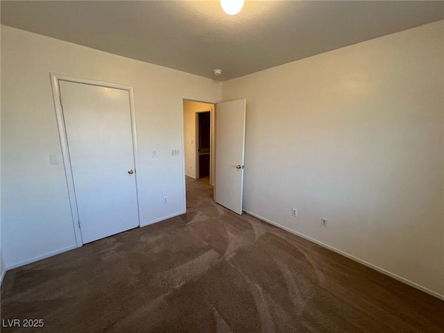 8704 Autumn Wreath Ave, Las Vegas, NV 89129 - unfurnished bedroom featuring carpet floors and baseboards