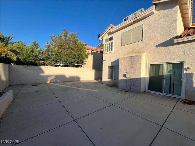 8704 Autumn Wreath Ave, Las Vegas, NV 89129 - fenced backyard with a patio area