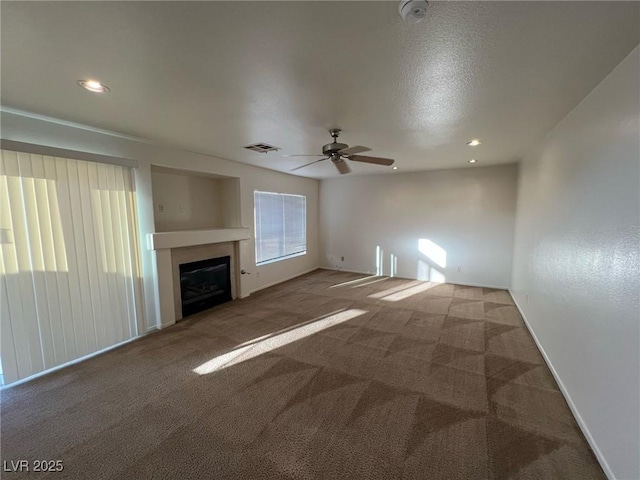 8704 Autumn Wreath Ave, Las Vegas, NV 89129 - unfurnished living room featuring a ceiling fan, carpet flooring, a fireplace, and recessed lighting