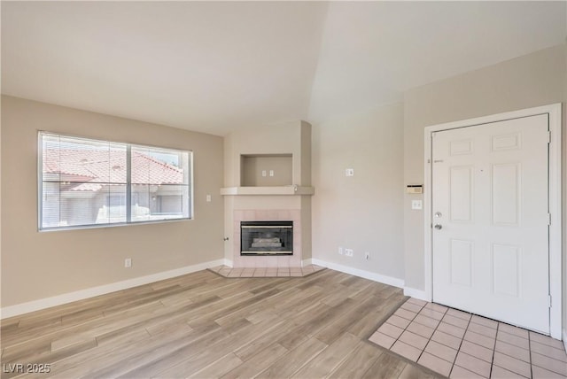 370 Manti Pl Unit 21, Henderson, NV 89014 - unfurnished living room with light wood-style flooring and a fireplace