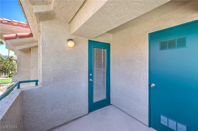 370 Manti Pl Unit 21, Henderson, NV 89014 - property entrance featuring a balcony and stucco siding