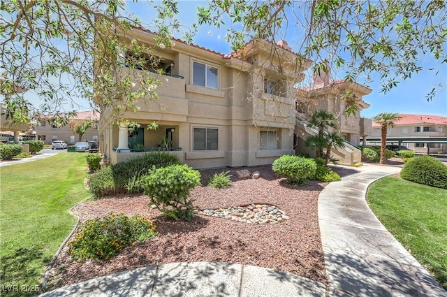 370 Manti Pl Unit 21, Henderson, NV 89014 - back of property featuring a lawn and stucco siding