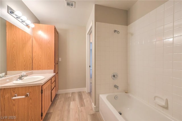 370 Manti Pl Unit 21, Henderson, NV 89014 - bathroom featuring vanity, wood finished floors, and shower / bathtub combination