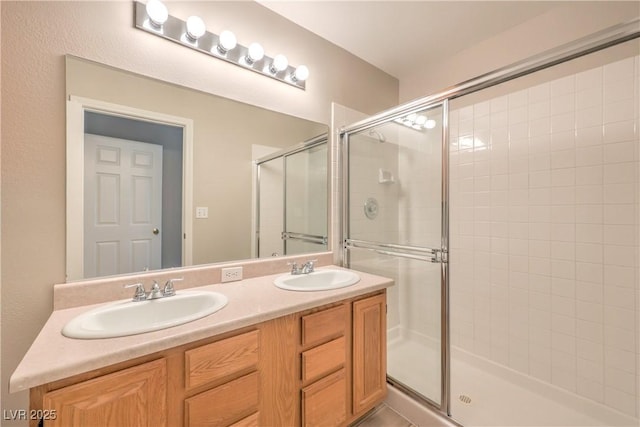 370 Manti Pl Unit 21, Henderson, NV 89014 - bathroom featuring a shower stall and double vanity