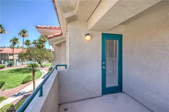 370 Manti Pl Unit 21, Henderson, NV 89014 - view of exterior entry with a balcony and stucco siding