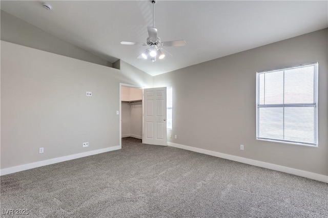 370 Manti Pl Unit 21, Henderson, NV 89014 - unfurnished bedroom featuring carpet, vaulted ceiling, ceiling fan, a walk in closet, and a closet