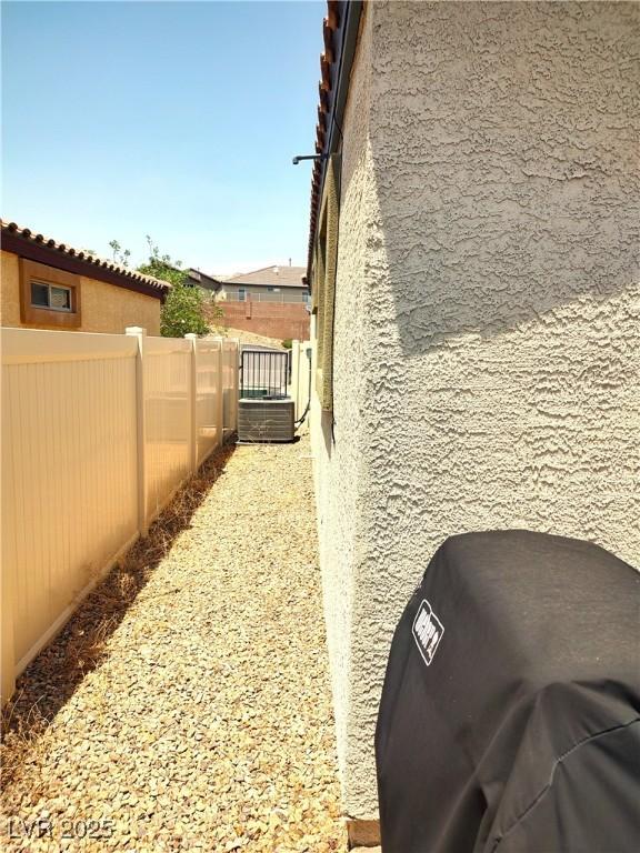 2822 Chetco River St, Laughlin, NV 89029 - view of home's exterior with stucco siding and a central air condition unit