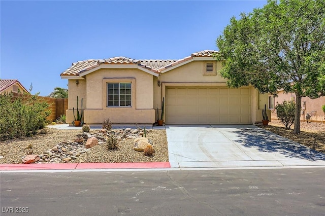 4361 Valley Quail Way N, Las Vegas, NV 89084 - view of front of home featuring a tile roof, stucco siding, a garage, and driveway