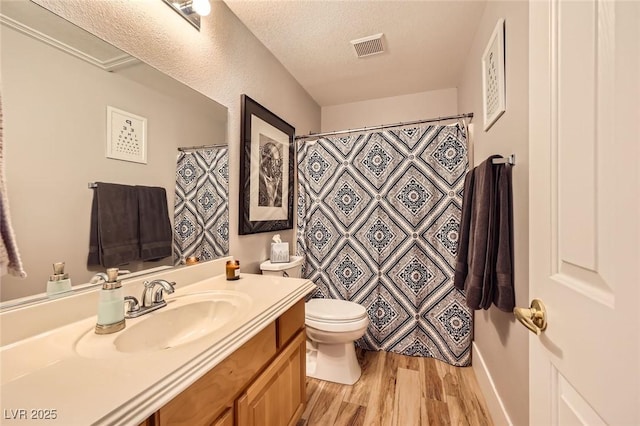 4361 Valley Quail Way N, Las Vegas, NV 89084 - bathroom featuring wood finished floors, vanity, a textured ceiling, and curtained shower