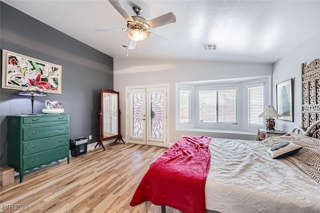 4361 Valley Quail Way N, Las Vegas, NV 89084 - bedroom featuring vaulted ceiling, wood finished floors, access to exterior, and a ceiling fan