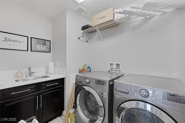 7890 S Miller Ln, Las Vegas, NV 89113 - laundry area featuring washer and dryer and cabinet space