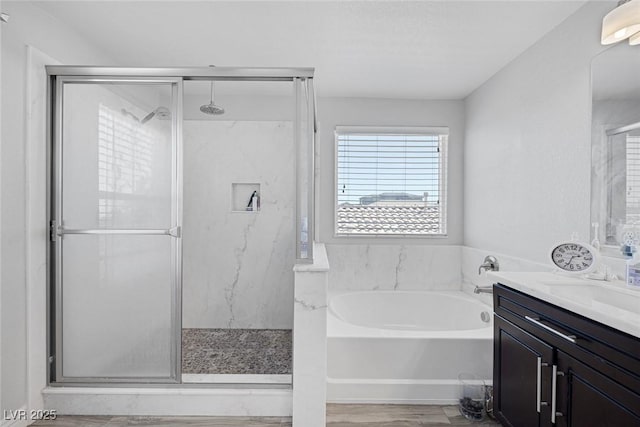 7890 S Miller Ln, Las Vegas, NV 89113 - bathroom featuring a marble finish shower, a bath, and vanity