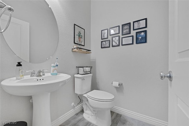 7890 S Miller Ln, Las Vegas, NV 89113 - bathroom featuring toilet and wood finished floors