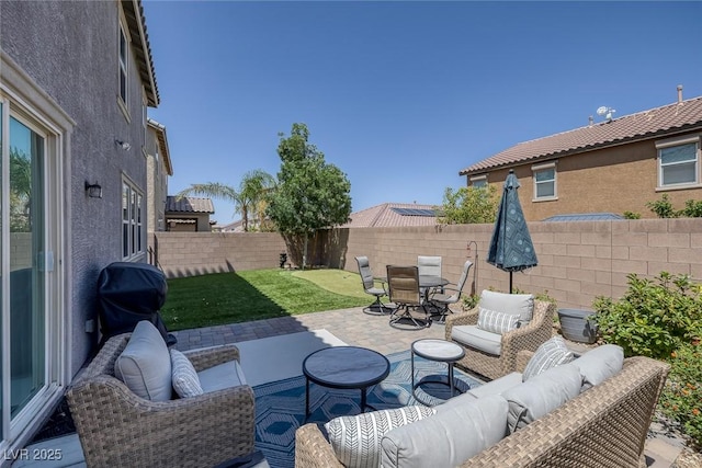 7890 S Miller Ln, Las Vegas, NV 89113 - fenced backyard with an outdoor hangout area, a patio area, grilling area, and outdoor dining area