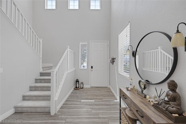 7890 S Miller Ln, Las Vegas, NV 89113 - foyer entrance featuring a towering ceiling, stairs, and plenty of natural light