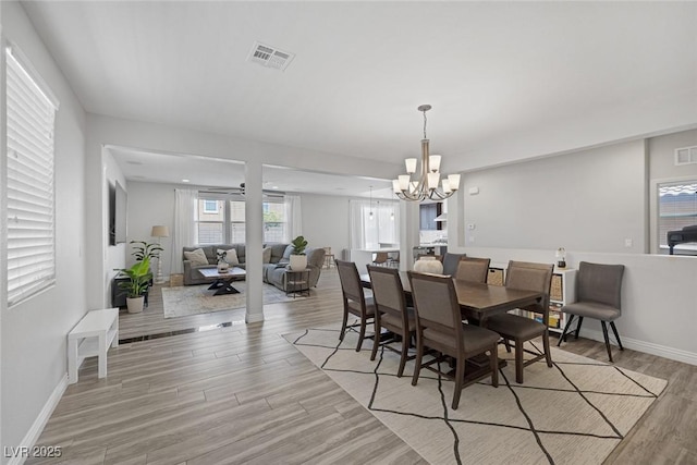 7890 S Miller Ln, Las Vegas, NV 89113 - dining room featuring light wood finished floors and a chandelier