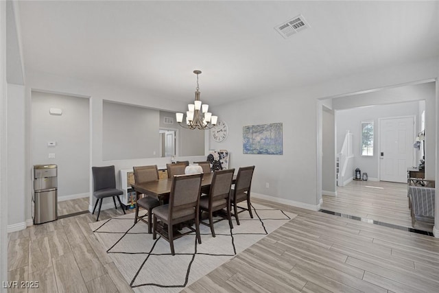 7890 S Miller Ln, Las Vegas, NV 89113 - dining space featuring a chandelier and light wood finished floors