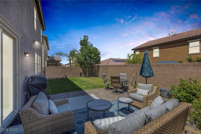 7890 S Miller Ln, Las Vegas, NV 89113 - fenced backyard with outdoor lounge area, a patio area, outdoor dining space, and grilling area