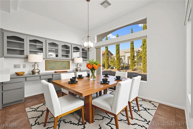 10920 Grand Haven Ave, Las Vegas, NV 89134 - dining area with a chandelier and tile patterned flooring