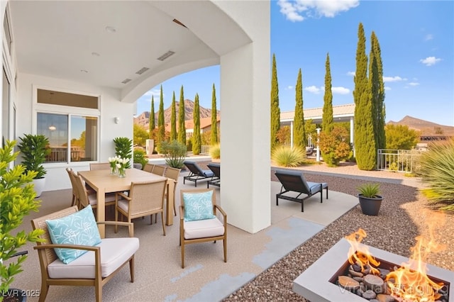 10920 Grand Haven Ave, Las Vegas, NV 89134 - view of patio / terrace featuring a fire pit and outdoor dining area