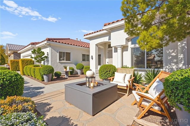 10920 Grand Haven Ave, Las Vegas, NV 89134 - view of patio featuring an outdoor living space with a fire pit