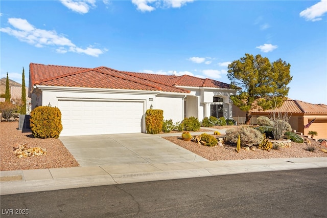 10920 Grand Haven Ave, Las Vegas, NV 89134 - mediterranean / spanish-style home with a tile roof, an attached garage, stucco siding, and driveway