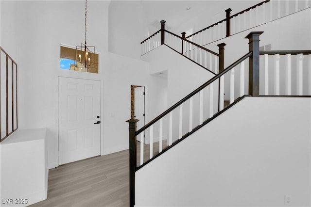 21 Rue De Degas, Henderson, NV 89074 - foyer entrance featuring a towering ceiling, wood finished floors, stairs, and a chandelier