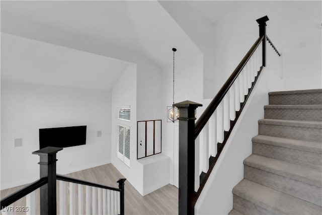 21 Rue De Degas, Henderson, NV 89074 - stairway featuring wood finished floors, high vaulted ceiling, and a chandelier