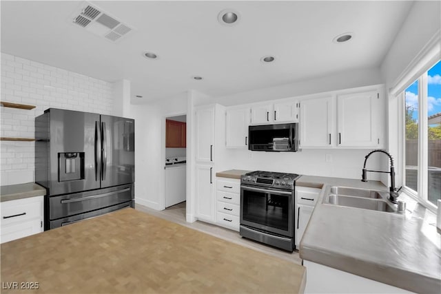 21 Rue De Degas, Henderson, NV 89074 - kitchen with appliances with stainless steel finishes, white cabinetry, backsplash, open shelves, and recessed lighting