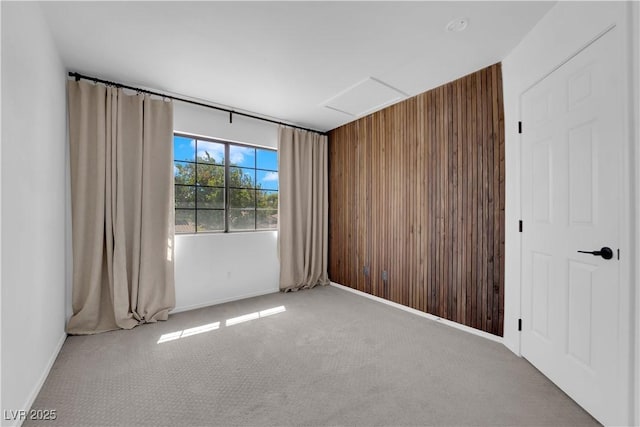 21 Rue De Degas, Henderson, NV 89074 - empty room with wood walls, carpet floors, and attic access