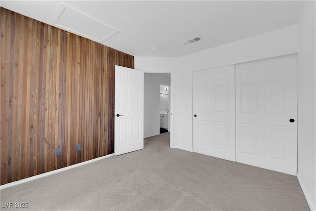 21 Rue De Degas, Henderson, NV 89074 - unfurnished bedroom with wooden walls, carpet flooring, and a closet