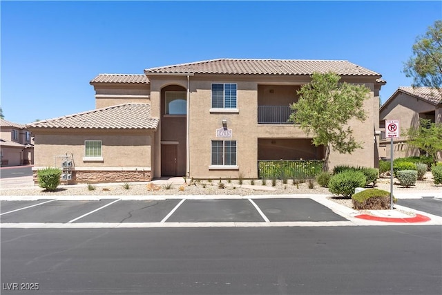 6635 Caporetto Ln Unit 204, North Las Vegas, NV 89084 - view of property featuring uncovered parking