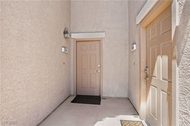 6635 Caporetto Ln Unit 204, North Las Vegas, NV 89084 - doorway to property with stucco siding