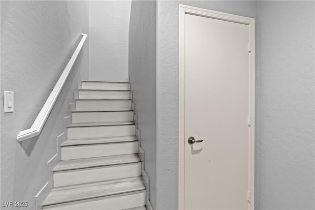 6635 Caporetto Ln Unit 204, North Las Vegas, NV 89084 - stairway with a textured wall