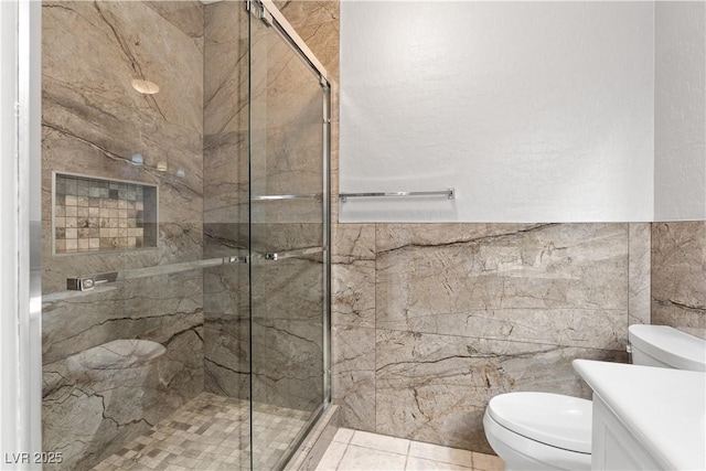 6635 Caporetto Ln Unit 204, North Las Vegas, NV 89084 - full bath featuring tile walls, vanity, and a shower stall