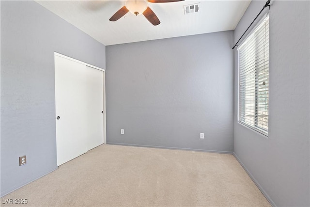 6635 Caporetto Ln Unit 204, North Las Vegas, NV 89084 - unfurnished bedroom featuring carpet floors, a closet, and ceiling fan