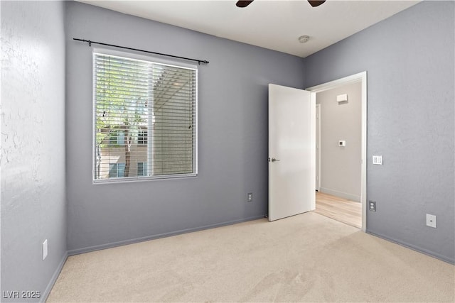 6635 Caporetto Ln Unit 204, North Las Vegas, NV 89084 - unfurnished bedroom with carpet and a ceiling fan