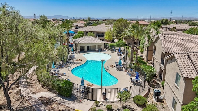 6635 Caporetto Ln Unit 204, North Las Vegas, NV 89084 - community pool with a residential view and a patio area
