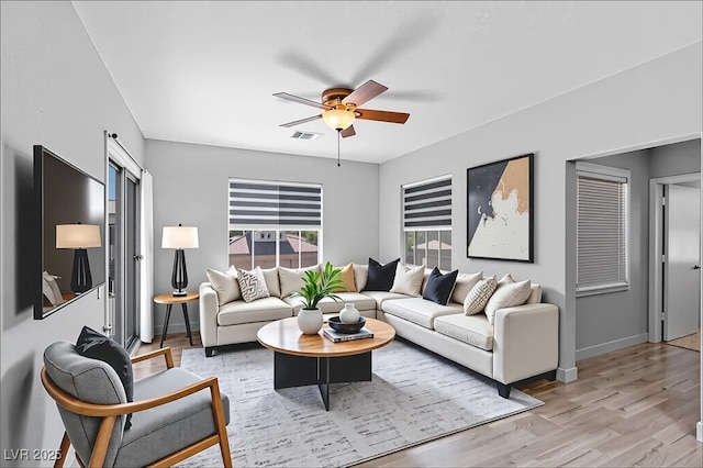 6635 Caporetto Ln Unit 204, North Las Vegas, NV 89084 - living room with a ceiling fan and light wood finished floors