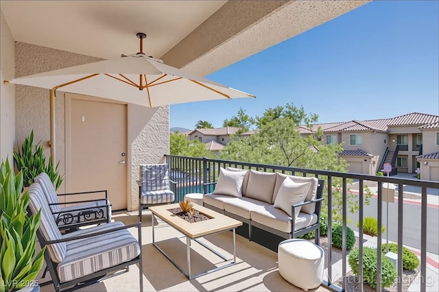 6635 Caporetto Ln Unit 204, North Las Vegas, NV 89084 - balcony with an outdoor living space with a fire pit and a residential view