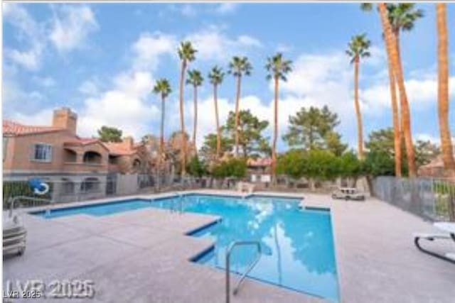 221 Mission Catalina Ln Unit 104, Las Vegas, NV 89107 - community pool featuring a patio area