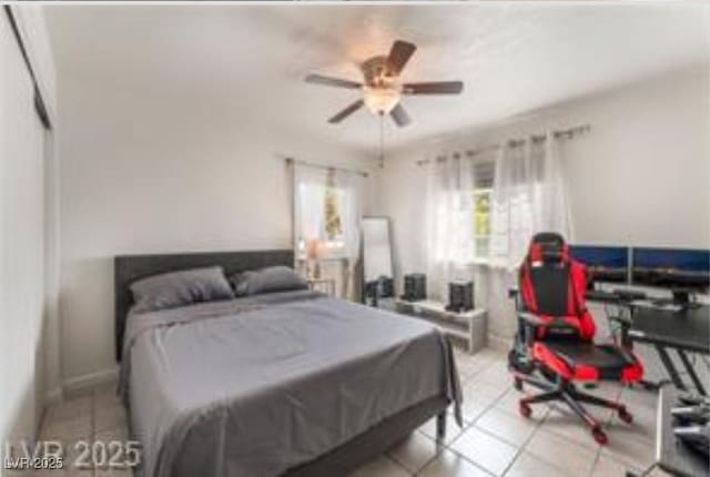 221 Mission Catalina Ln Unit 104, Las Vegas, NV 89107 - tiled bedroom with ceiling fan