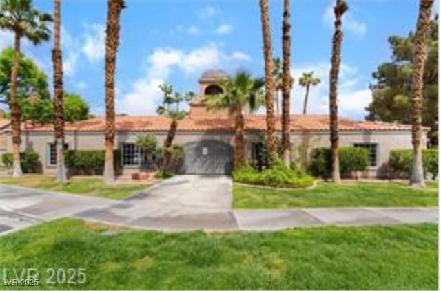 221 Mission Catalina Ln Unit 104, Las Vegas, NV 89107 - view of front of house with a front lawn