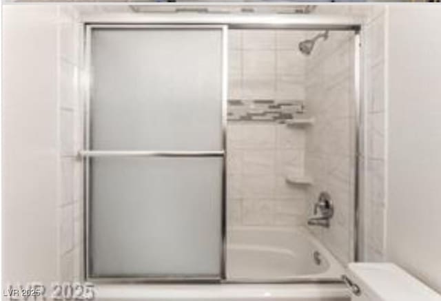 221 Mission Catalina Ln Unit 104, Las Vegas, NV 89107 - full bath featuring toilet and combined bath / shower with glass door