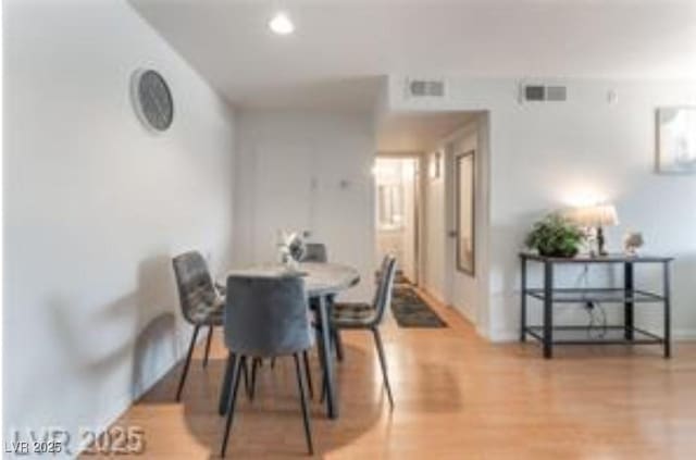 221 Mission Catalina Ln Unit 104, Las Vegas, NV 89107 - dining space with wood finished floors and recessed lighting