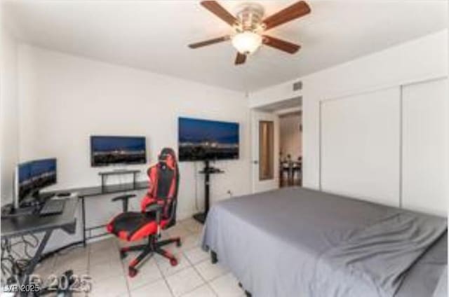 221 Mission Catalina Ln Unit 104, Las Vegas, NV 89107 - bedroom featuring light tile patterned floors and a closet